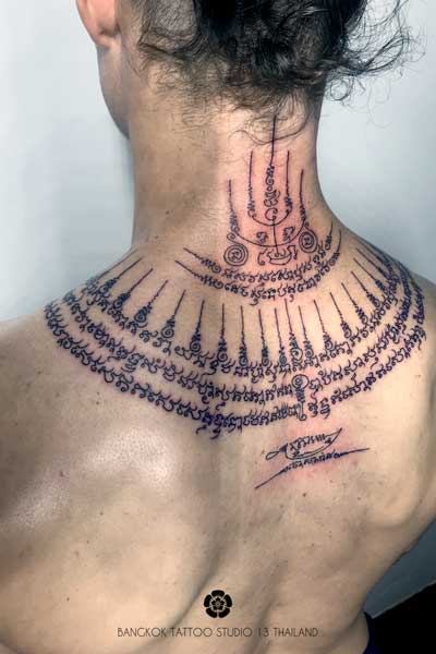 sak yant neck 5 rows lines thailand tattoo bangkok